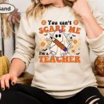 You Can’t Scare Me, I’m a Teacher Halloween Sweatshirt – Funny Ghost Design | Cozy, Durable & Perfect for Spooky School Spirit