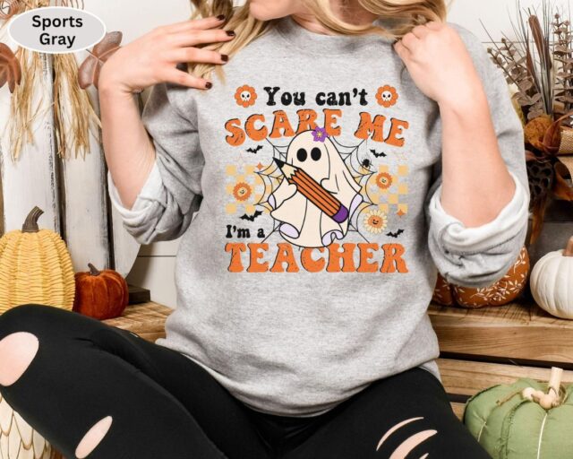 You Can’t Scare Me, I’m a Teacher Halloween Sweatshirt – Funny Ghost Design | Cozy, Durable & Perfect for Spooky School Spirit