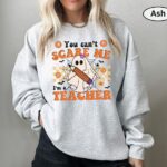 You Can’t Scare Me, I’m a Teacher Halloween Sweatshirt – Funny Ghost Design | Cozy, Durable & Perfect for Spooky School Spirit